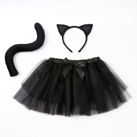 a black cat costume with a tutu and headband is shown next to an adult's tail