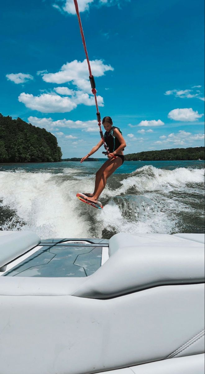 a person on a water ski being pulled by a boat