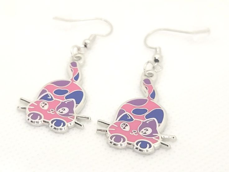 pair of pink and blue cat earrings on white background