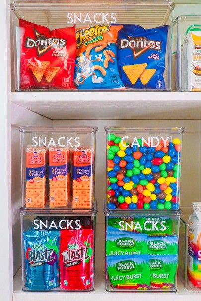 an organized pantry filled with candy and snacks