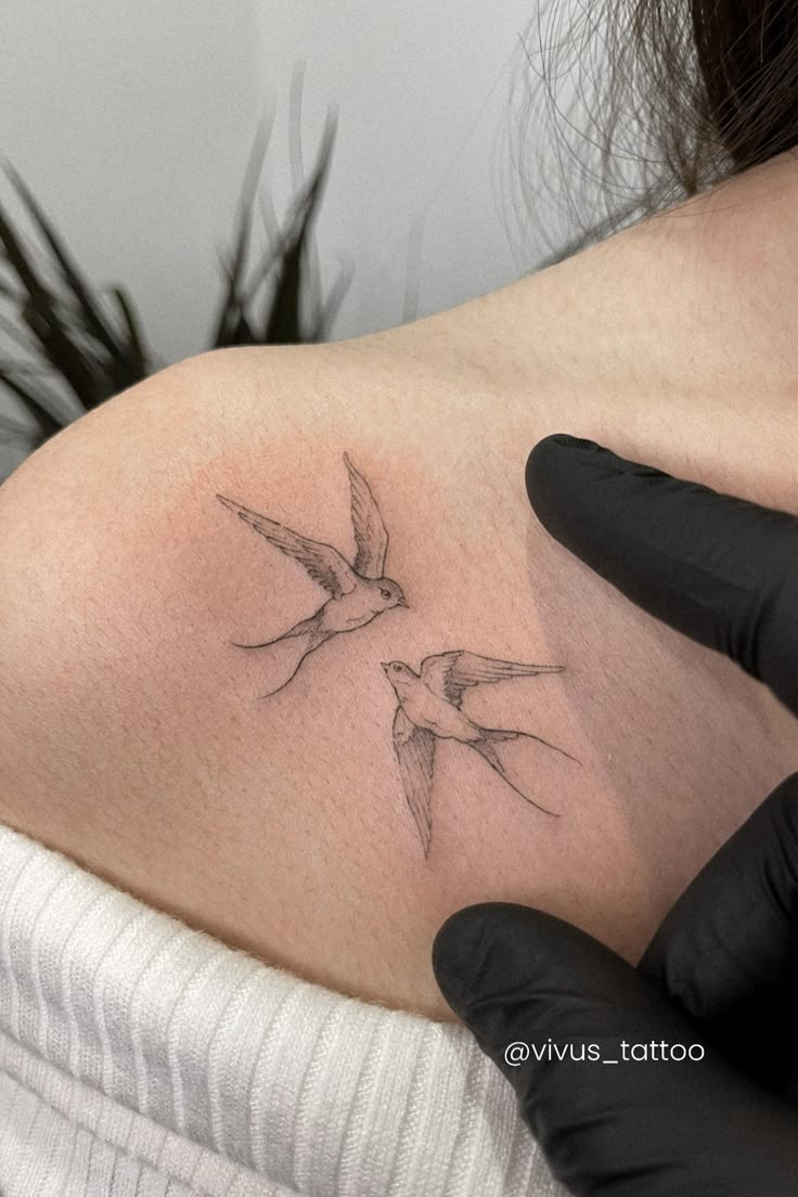 a woman with a tattoo on her stomach has a humming bird tattooed on her chest