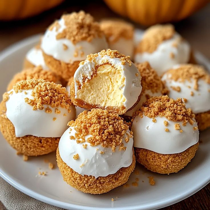 a white plate topped with mini desserts covered in frosting