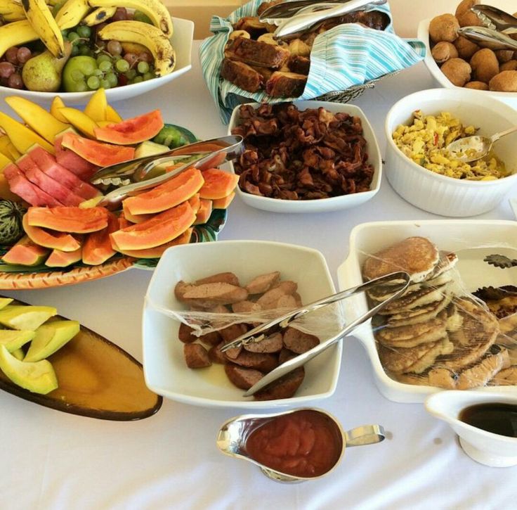 a table topped with bowls filled with different types of food