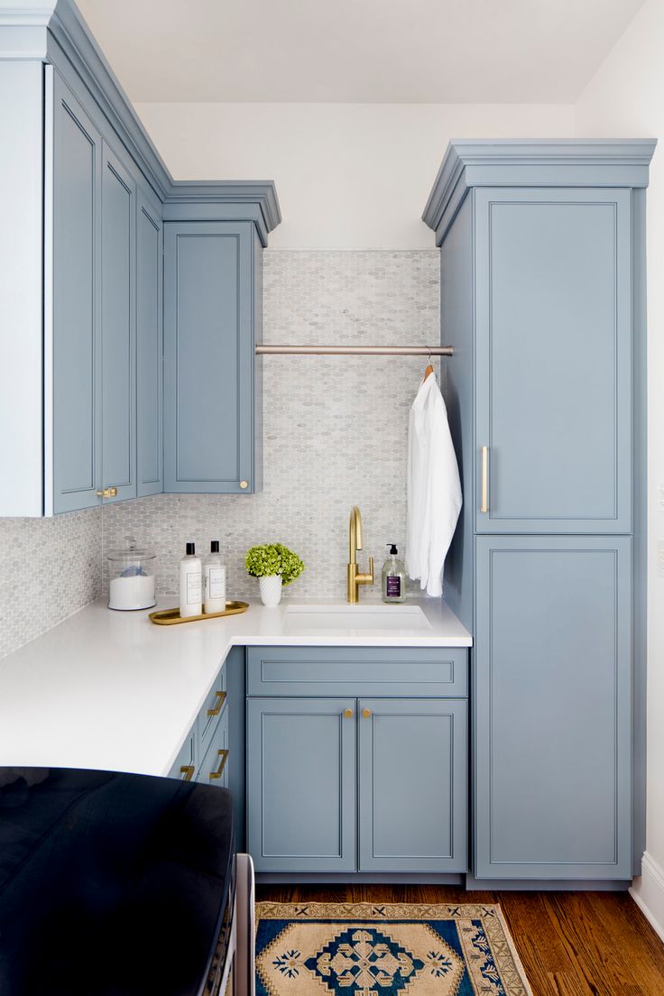 an image of a kitchen with blue cabinets and white counter tops on instagrams