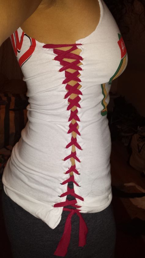 the back of a woman's white shirt with red laces