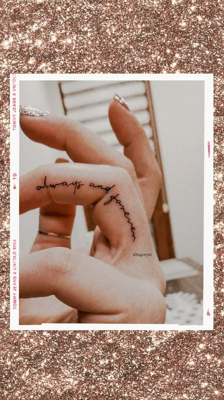 two hands holding each other with writing on them