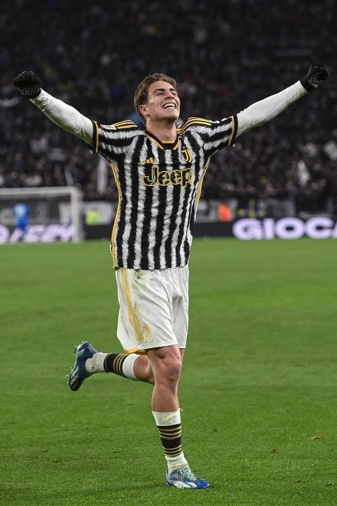 a soccer player is celebrating his goal on the field