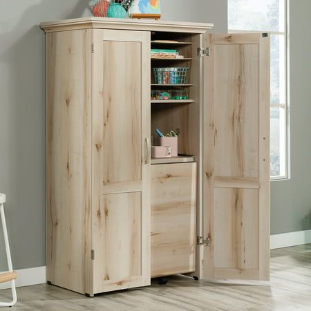 a wooden cabinet with two doors and shelves