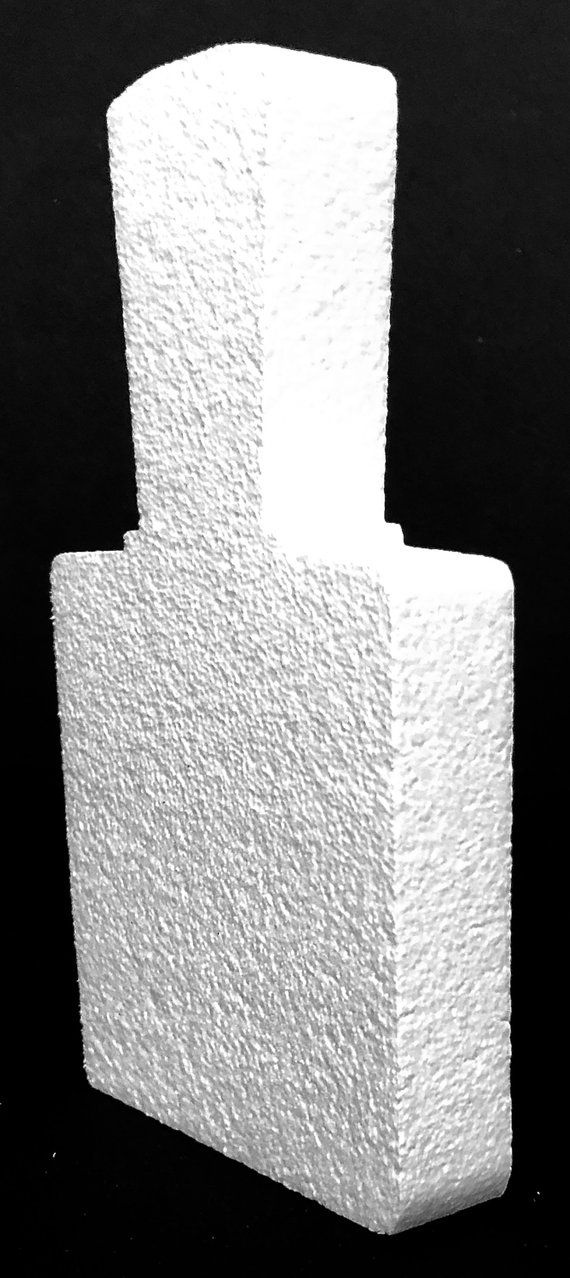 three white blocks stacked on top of each other in front of a black background,