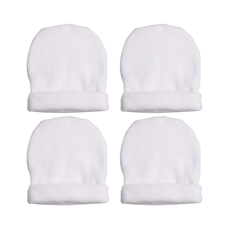 four white baby hats on top of each other