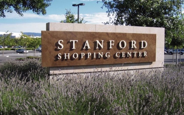 the sign for stanford shopping center is surrounded by lavender