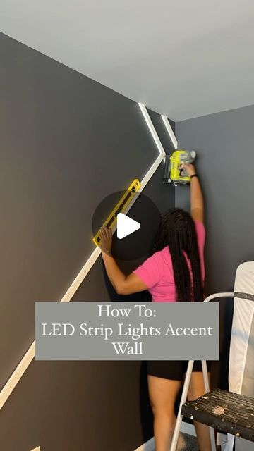 a woman is painting the walls in her bedroom