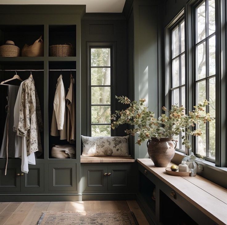 a room filled with lots of windows next to a wooden bench and window sill