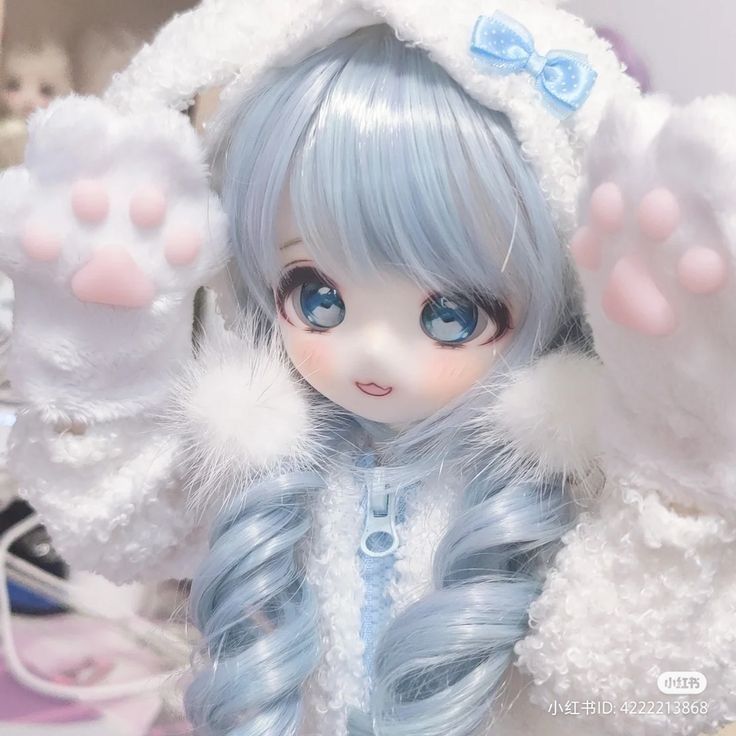 a close up of a doll with blue hair and white fur on it's head