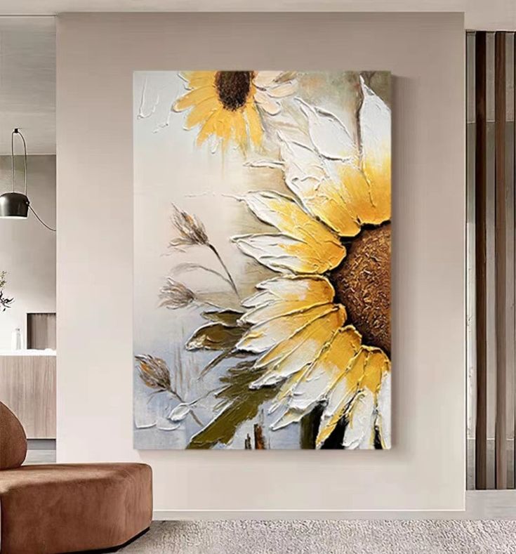 a large sunflower painting hanging in a living room