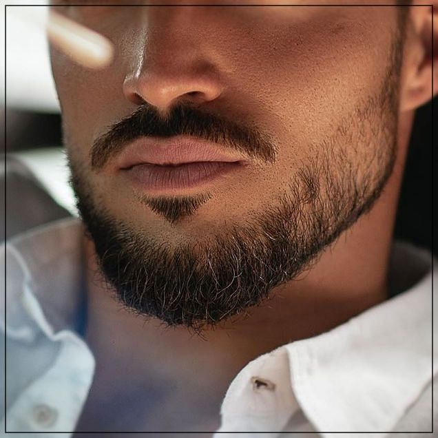 a close up of a man with a beard