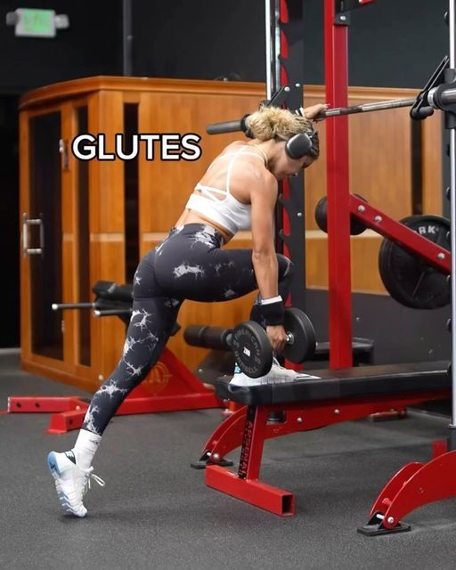 a woman doing squats in front of a barbell with the words glutes above her