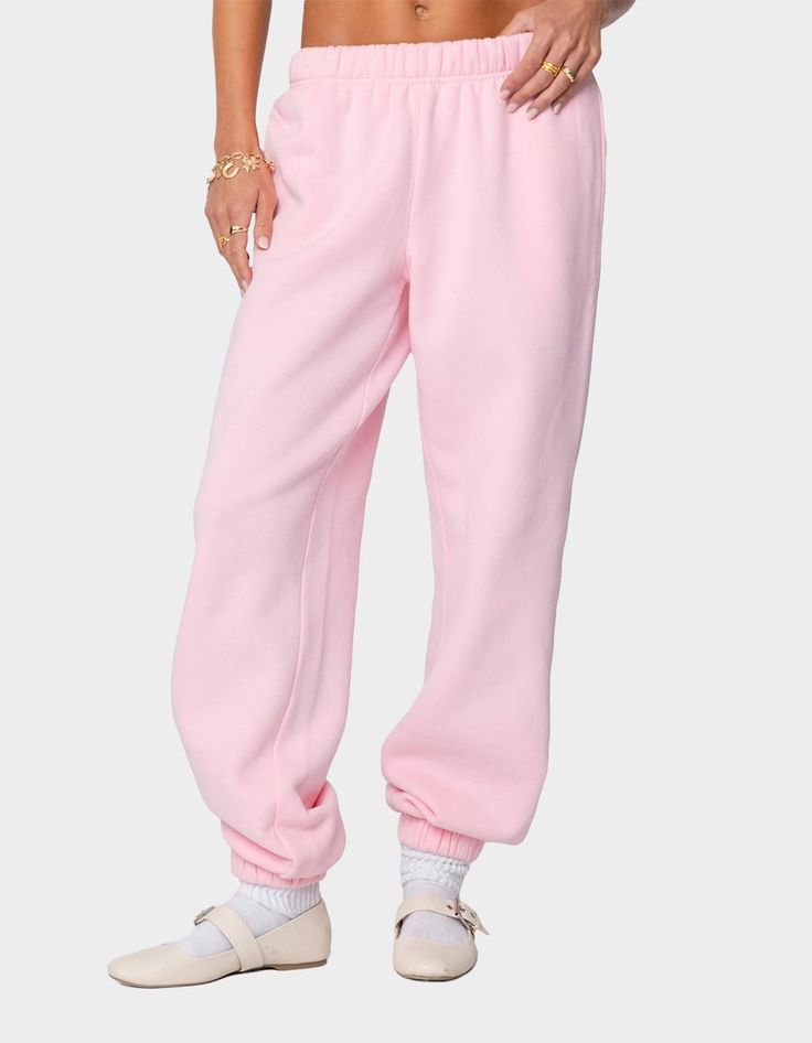 Reach Your Ultimate Level Of Coziness, While Still Feeling On-Trend With These Perfect Oversized Sweatpants. Sweatpants. Oversized Fit. 50% Cotton, 50% Polyester. Model Wears Size S. Model Height Is 5'9. Item Care: Machine Wash At Maximum 30ºc, Do Not Bleach, Do Not Tumble Dry, Iron At A Maximum Of 110ºc, Do Not Dry Clean. | Edikted Clark Oversized Sweatpants Comfortable Pink Bottoms For Fall, Comfortable Pink Fall Bottoms, Trendy Oversized Bottoms With Elastic Waistband, Pink Leisure Bottoms For Fall, Oversized Spring Sweatpants With Elastic Waistband, Comfortable Oversized Solid Bottoms, Oversized High-waisted Lounge Pants, Oversized High-waisted Pants For Loungewear, Pink Relaxed Fit Sweatpants For Fall