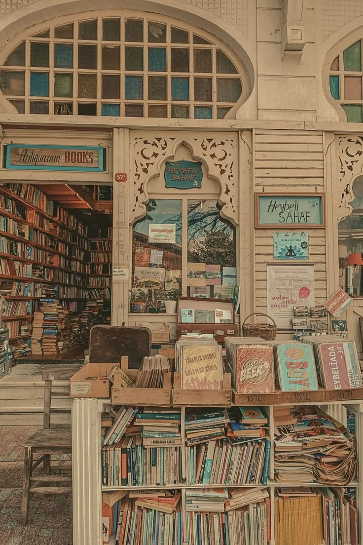 an old book store with lots of books on the front and shelves full of books