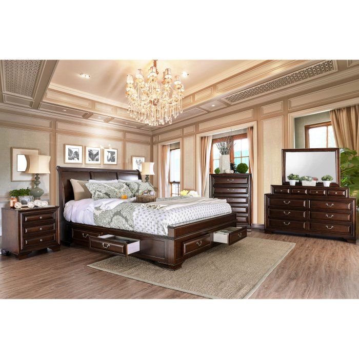 a bedroom with a large bed, dresser and mirror in the middle of the room