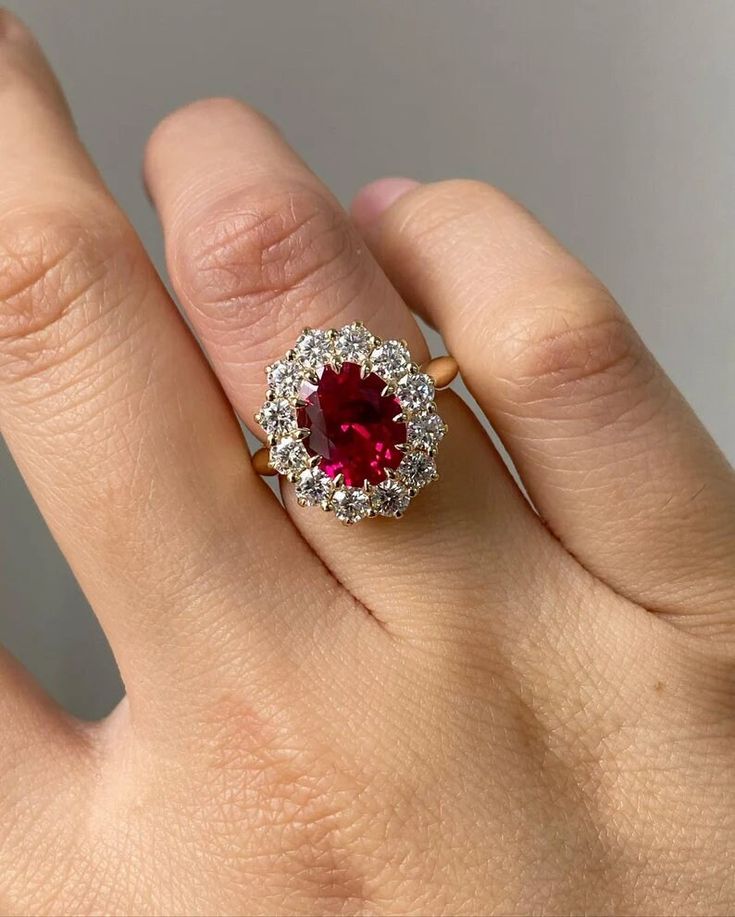 5.00 CT Oval Cut CZ Red Ruby Diamond Engagement Ring Oval Flower Ring Anniversary Gift Ring Bridal Ring Gift For Her ♻︎𝐃𝐢𝐚𝐦𝐨𝐧𝐝 𝐃𝐞𝐭𝐚𝐢𝐥𝐬 ⇛𝐃𝐞𝐭𝐚𝐢𝐥𝐬 𝐨𝐟 𝐦𝐚𝐢𝐧 (𝐜𝐞𝐧𝐭𝐞𝐫) 𝐬𝐭𝐨𝐧𝐞 ⇒Type of Diamond: Moissanite/Cubic Zirconia ⇒Size: 10.00x8.00 mm ⇒Weight: 3.00 ct ⇒Shape: Oval ⇒Color: D (White/colorless) ⇒Clarity: VVS1 ⇒Cut: Excellent ⇒Band width: 1.7mm ⇒Band thickness: 1.6mm ⇛Details of side stone ⇒Type of Diamond: Moissanite/Cubic Zirconia ⇒Shape: Round ⇒Color: D (White/colorless) ⇒Clarity: VVS1 ⇒Cut: Excellent ♻︎𝗥𝗶𝗻𝗴 𝗦𝗶𝘇𝗲 ⇒From 4 US - 15 US all ring sizes are available, even half and quarter sizes are also available. Just for an example 4, 4 ¼, 4 ½, 4 ¾, 5 US. Kindly choose the perfect ring size while placing an order, you can refer to the picture of the ri Ruby Royal Jewels, Large Ruby Ring, Ruby Engagement Ring White Gold, Ruby Ring Designs Unique, Ruby Engagement Ring Gold, Oval Ruby Engagement Ring, Ruby Jewelry Ring, Ruby Engagement Rings, Ruby Stone Ring