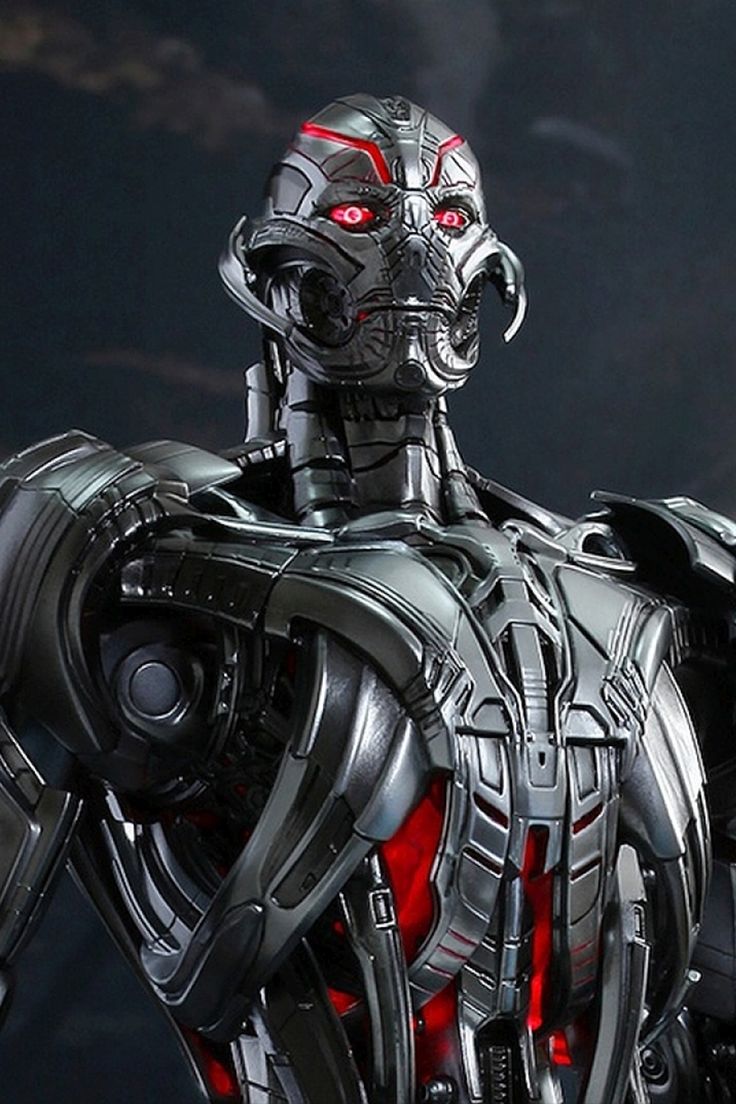 a close up of a robot with red eyes