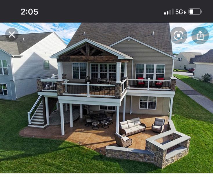 an aerial view of a house with patio and deck