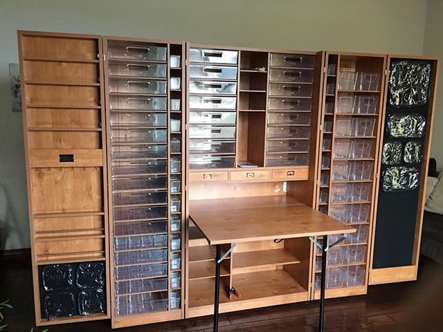 a wooden desk and shelves in a room