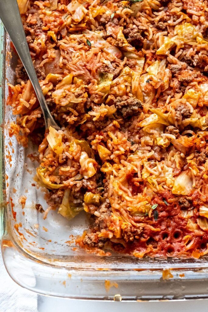 a casserole dish with meat and vegetables in it, ready to be eaten