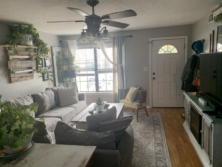 a living room filled with furniture and a flat screen tv