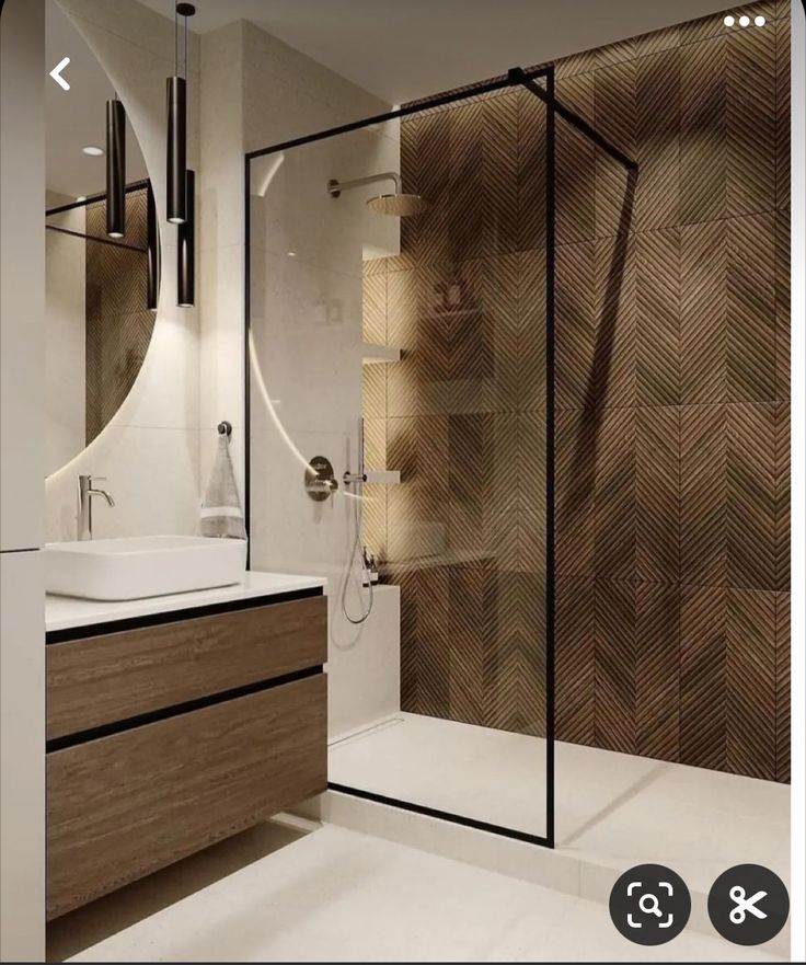 a bathroom with a sink, mirror and shower in it's center area is shown