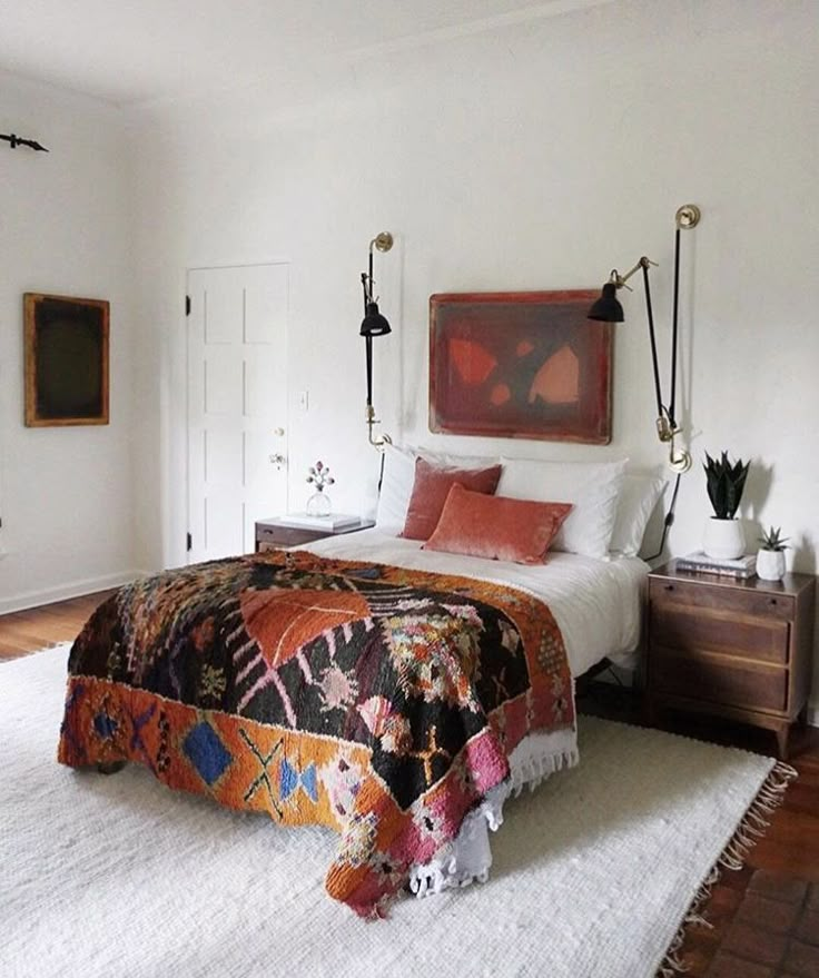 a bed sitting in a bedroom on top of a white rug