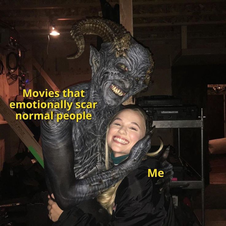 a woman is hugging a statue with the caption movies that emotionally scar normal people me