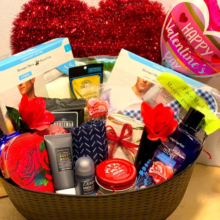 a gift basket filled with personal care products and valentine's day gifts for him