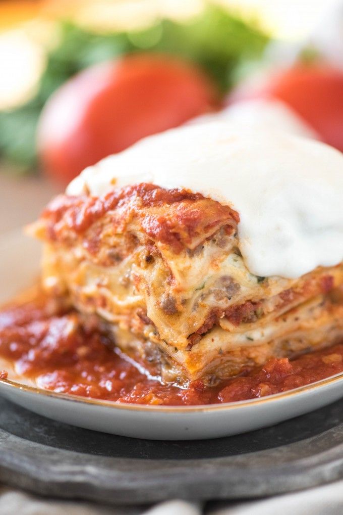 lasagna casserole on a plate with sour cream