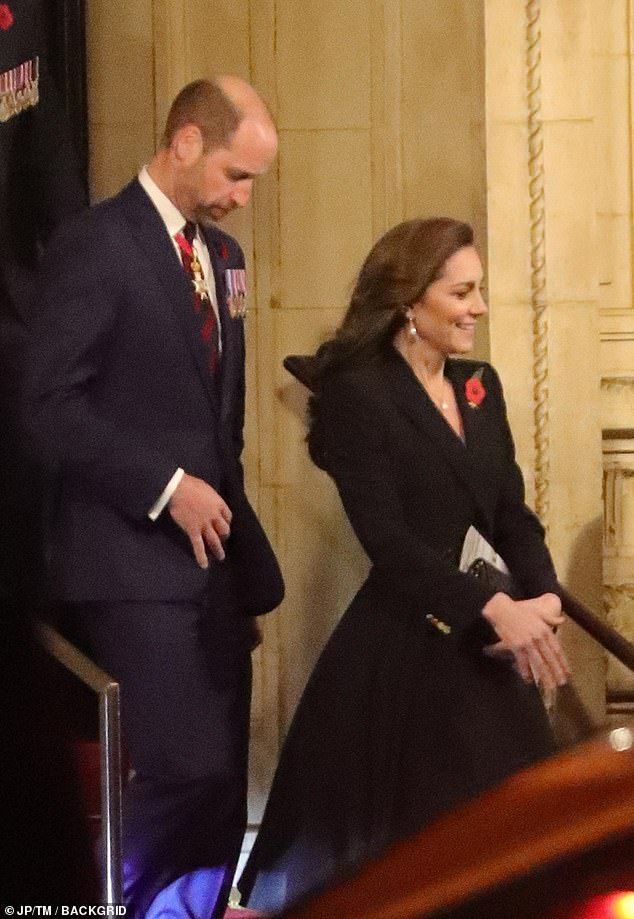 the duke and princess of cambridge are walking up steps together in their official dress clothes