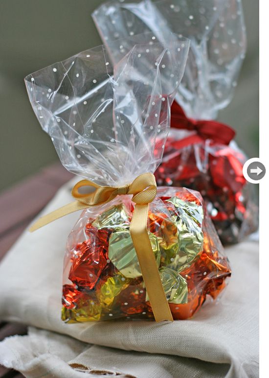 two bags filled with candy sitting on top of a table