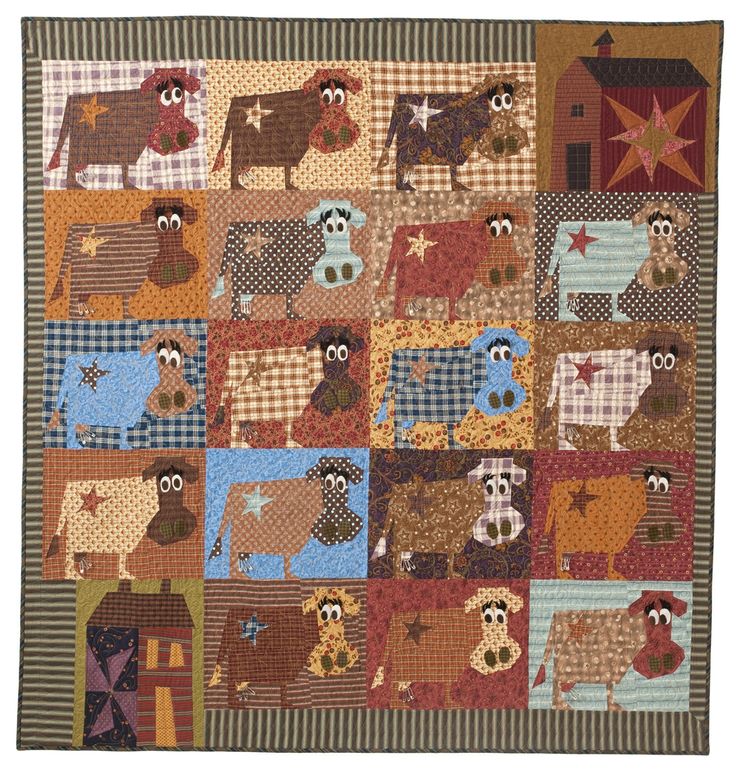 a patchwork quilt with farm animals on it