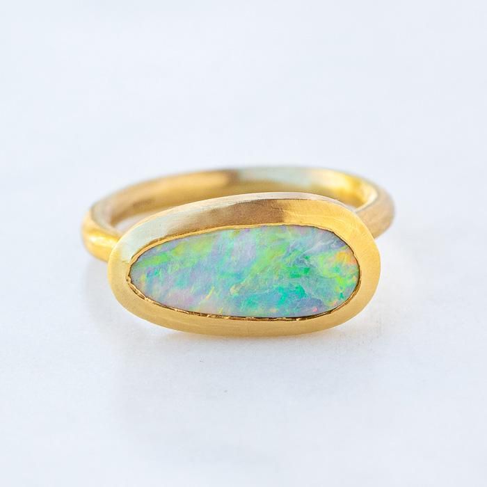 Our one of a kind Black Opal Forest Ring is set with a Lightning Ridge black opal. Opal measures 11 x 6mm. Band width 2mm. Pictured with a matte finish. For a high shine finish please leave a note at checkout. Please note, we will match the opal as close to the image as possible. Each opal is unique and may vary in appearance and colour from what is depicted on the site. Opal Gold Ring, Forest Ring, Lightning Ridge Black Opal, Opal Ring Gold, Lightning Ridge, Black Opal, White Opal, Opal Jewelry, Antique Rings