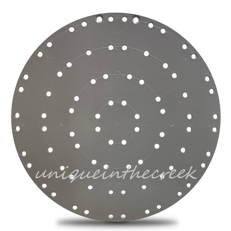 a circular metal object with white dots on it