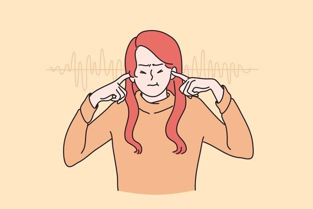 a woman with long red hair is listening to music on her ear and holding her hands behind her head