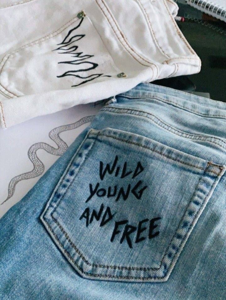 two pairs of jeans with writing on them