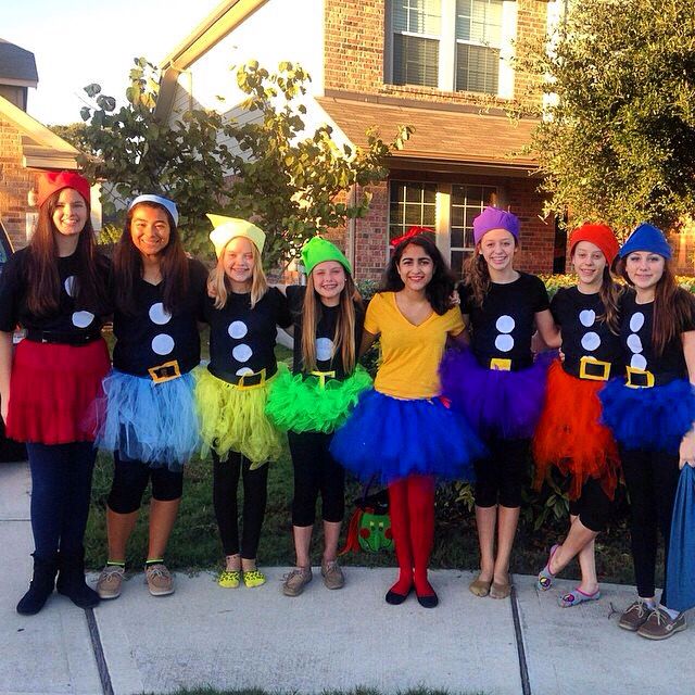 a group of girls dressed up in costumes