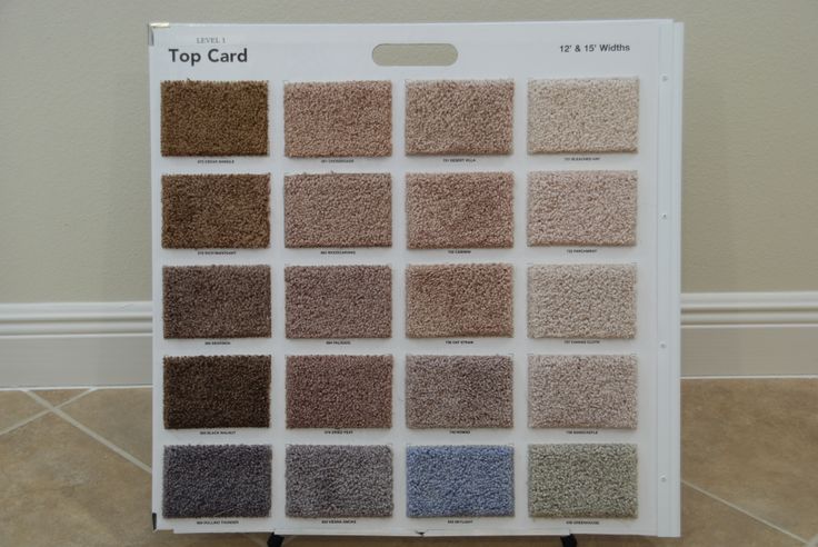 the top card for carpet samples is displayed in front of a tile flooring board