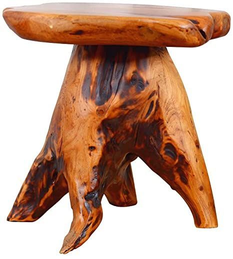 a wooden stool that is shaped like a tree stump