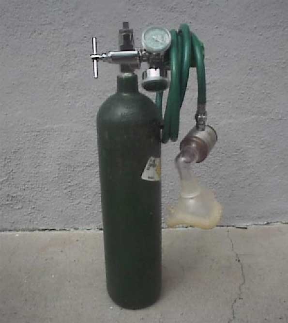 a propane cylinder with a hose attached to it and a water bottle in the foreground