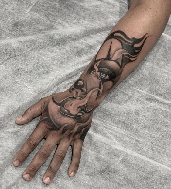 a man's hand with a tattoo on it and an elephant in the middle