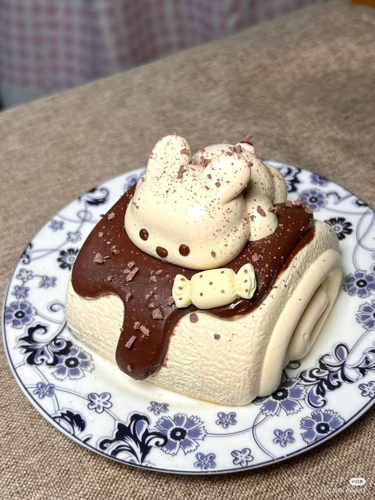 a piece of cake on a plate with chocolate and marshmallows in it