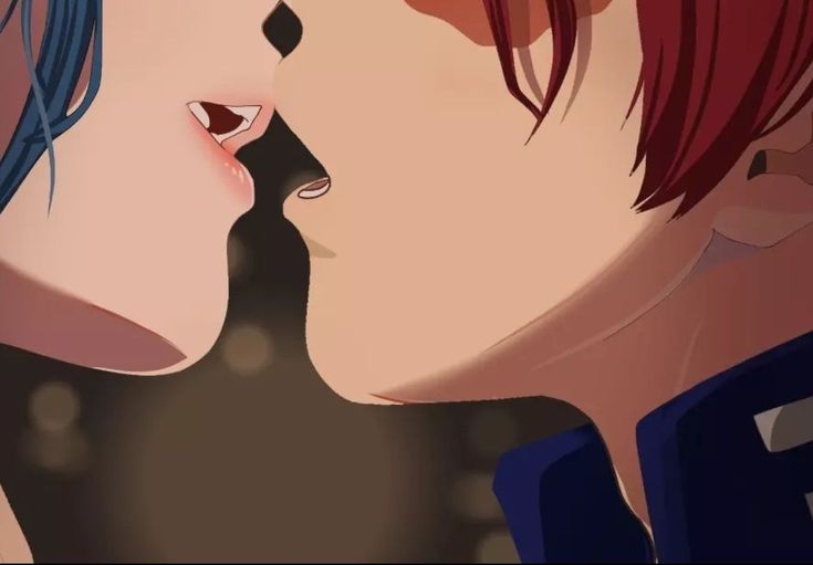 two people with red hair are kissing each other