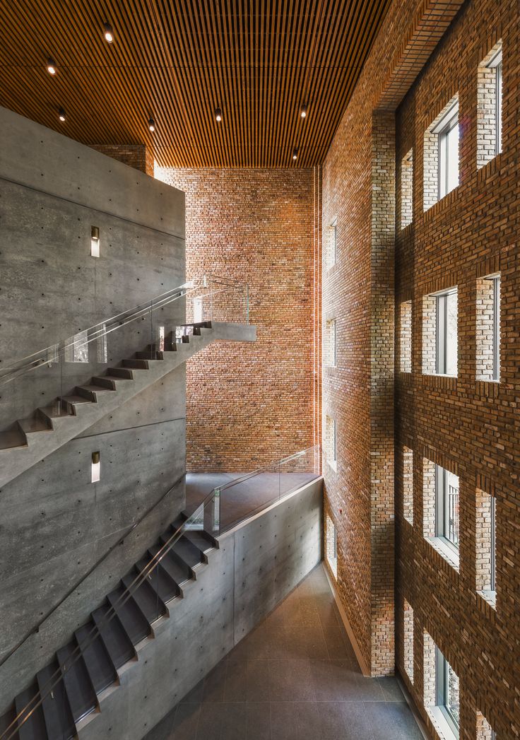 the inside of a building with brick walls and stairs